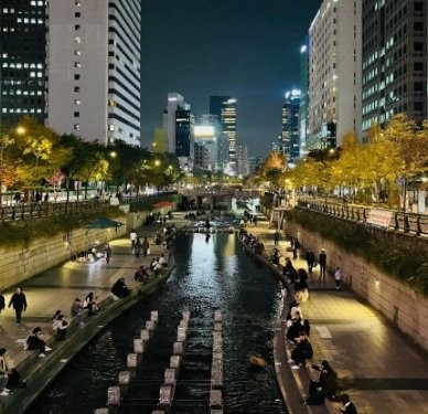 The Cheonggyecheon stream cutting through downtown Seoul with office towers on both sides