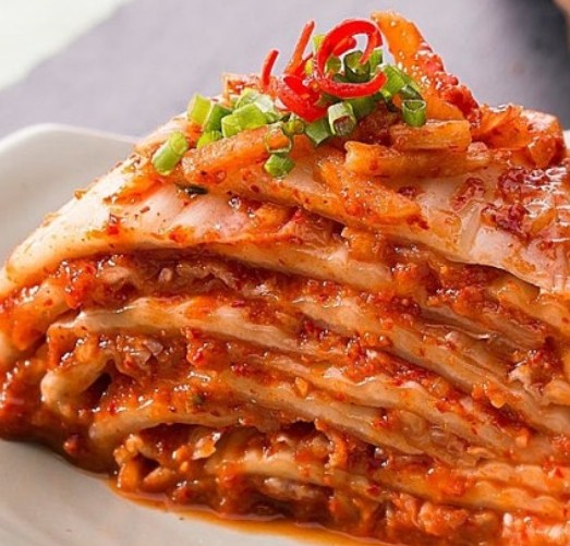 Baechu kimchi — napa cabbage coated in red gochugaru paste, the iconic Korean kimchi