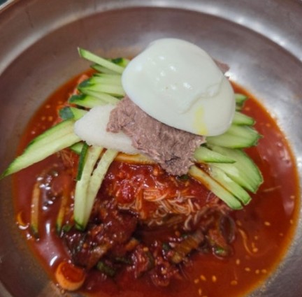 Bibim naengmyeon — Korean cold noodles tossed in a fiery red gochujang sauce