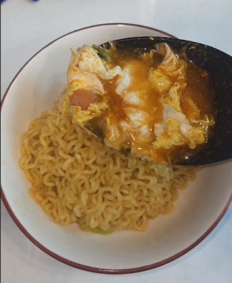 Finished Samyang ramen — broth and egg poured over the chewy noodles in a bowl