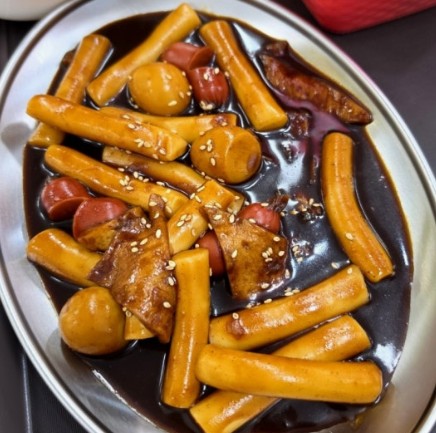 Jjajang tteokbokki — savory-sweet black-bean sauce over rice cakes